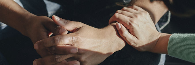 Closeup of comforting hands