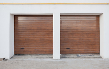 Double brown garage door in a new house