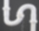 White plastic plumbing pipe with a U-bend leaking water against a gray background