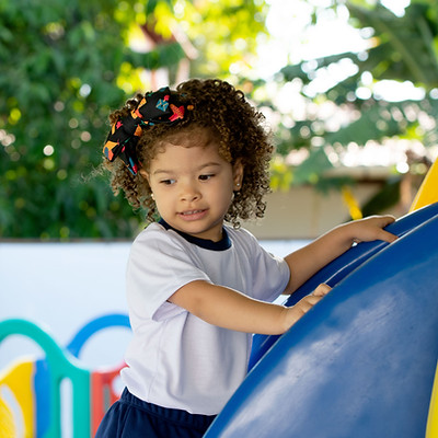 little girl playing on the playground
