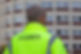 Guard standing outside block of flats, keeping watch
