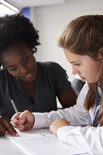 Teacher Helping Student