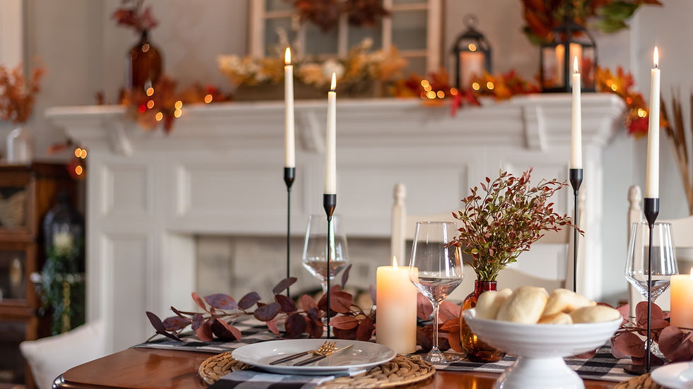 Elegant autumn table with lit candles, wine glasses, and bread — a calm holiday setting styled with Feng Shui balance in mind, Tampa Bay
