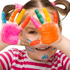 Portrait of a cute cheerful girl with painted hands, isolated over white