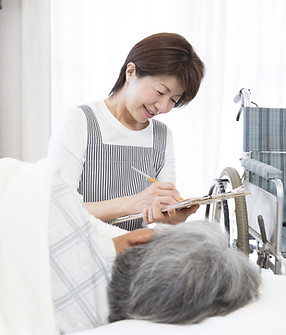 Nurse Writing on Clipboard