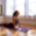 Woman doing a yoga class online at home