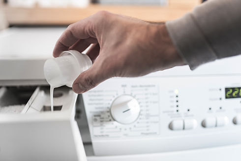 Pouring Laundry Detergent