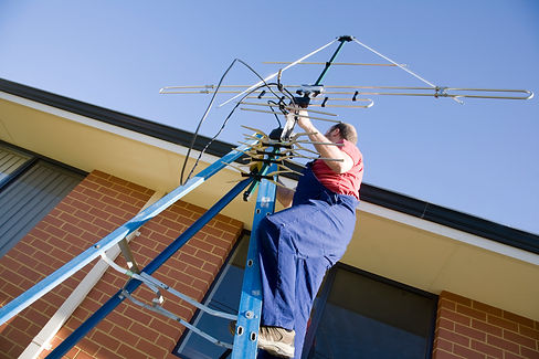 A man repairing TV aerial