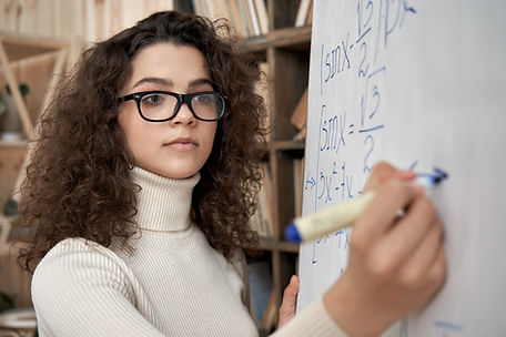 Woman Writing Equations