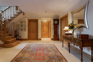 Rug and table in traditional foyer