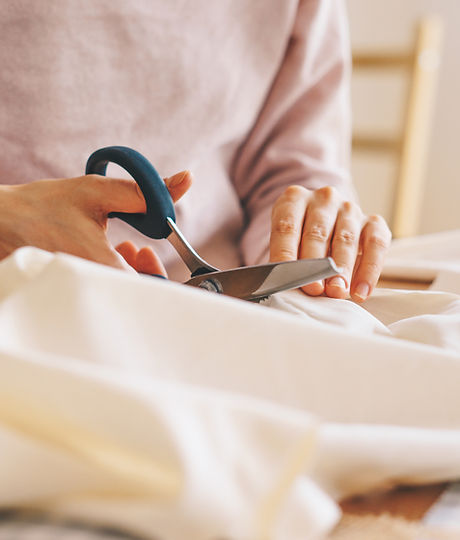 Woman Cutting Fabric