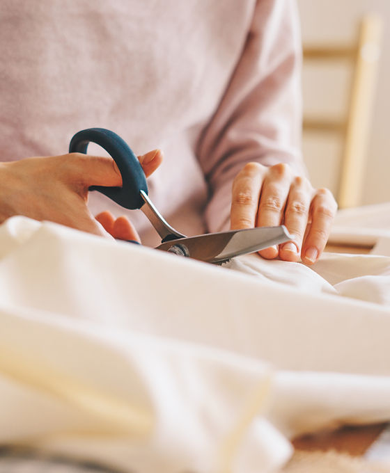 Woman Cutting Fabric