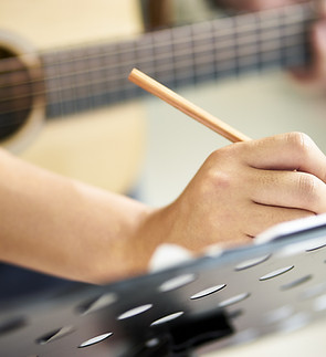 Guitarist Writing Song