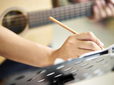 Guitarist Writing Song