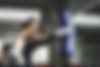 Woman Kicking Punching Bag