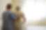 Caregiver walking senior to bed