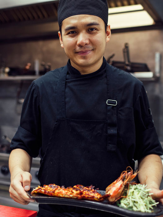 chef holding fancy meal