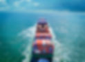 Aerial view of freight ship with cargo containers on the sea