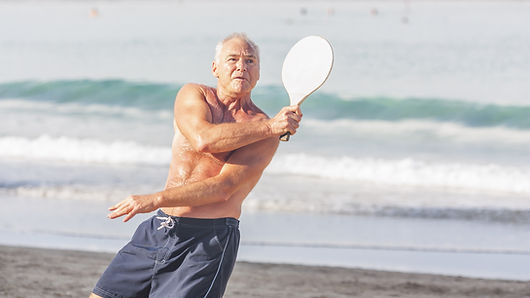 Playing Matkot on the Beach