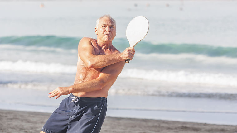 Playing Matkot on the Beach