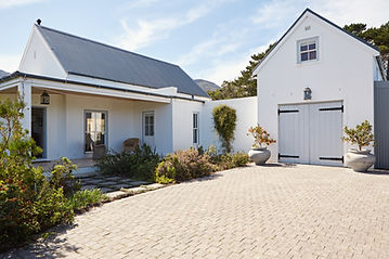 exterior of renovated home with modern style design and new finishes