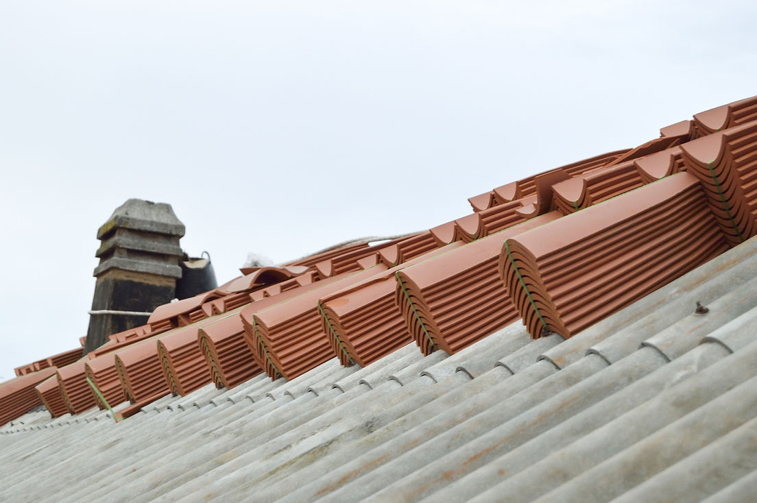 Close-up of a rooftop with red, interlocking terracotta tiles