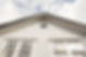 white exterior of a house looking up