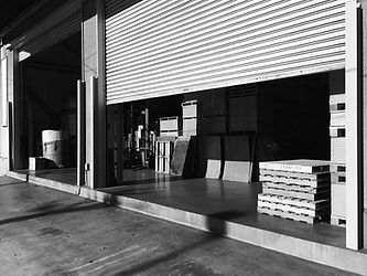 Crates In Factory Seen From Half Open Shutter