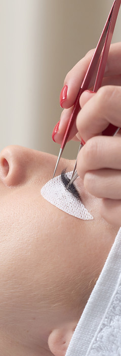 Professional applying false lashes