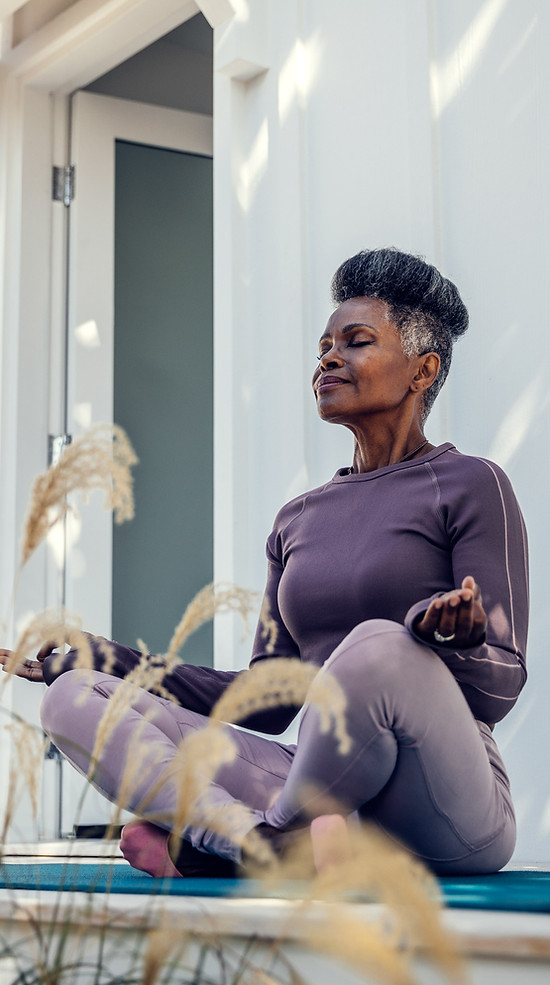 Woman meditating outdoors