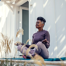 Woman meditating outdoors