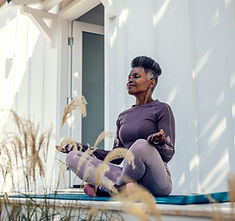Woman meditating outdoors