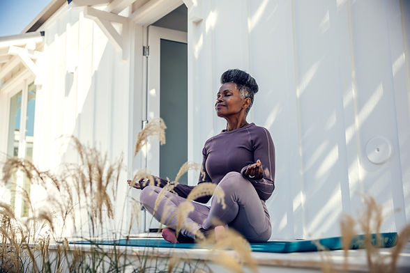 Woman meditating outdoors