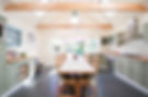 An interior view of a shaker style kitchen dining area