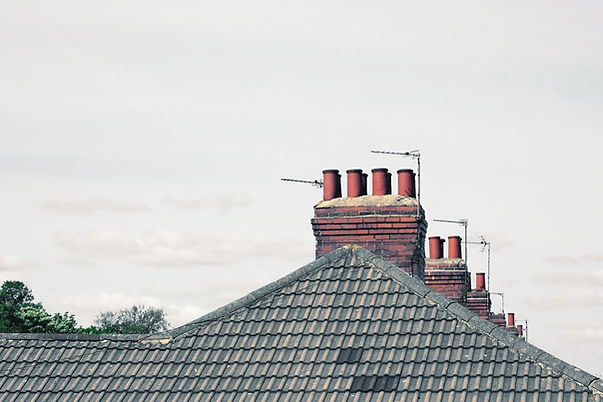 Terracotta chimney pots on a residential roof in Tunbridge Wells