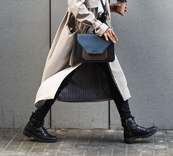A woman in a coat walking