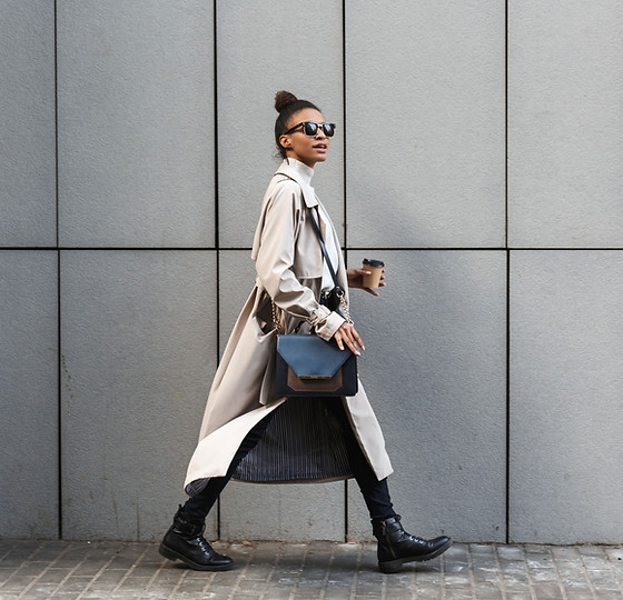 A woman in a coat walking