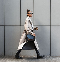 A woman in a coat walking