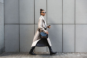 A woman in a coat walking