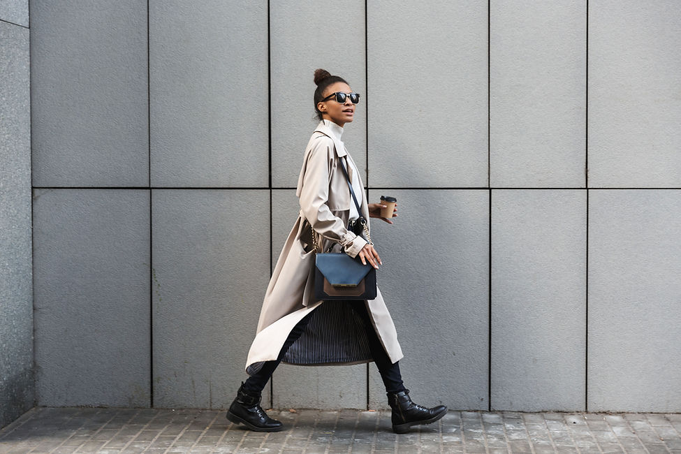 A woman in a coat walking