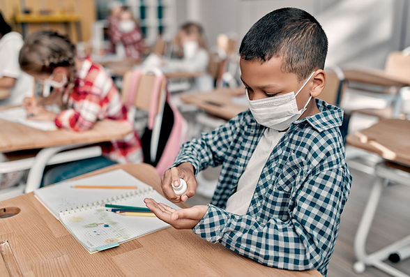 Child Using Hand Sanitizer