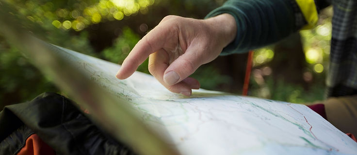 Property developers reviewing land appraisal maps and planning documents