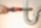 Tightening plumbing pipes with wrench