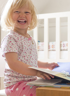 Girl Reading and Laughing
