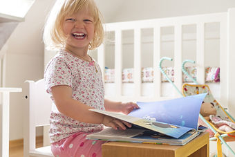Girl Reading and Laughing