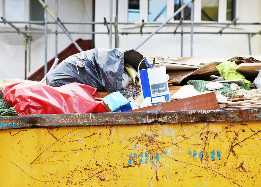 Full skip in front of house renovation