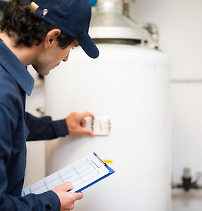 Plumber Inspecting Boiler