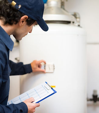 Plumber Inspecting Boiler