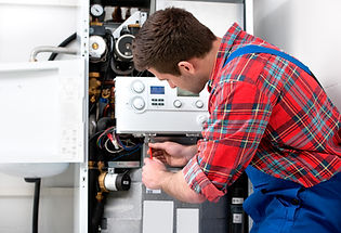 Technician servicing the gas boiler