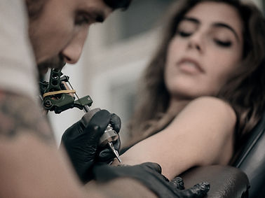 Girl Getting Arm Tattoo